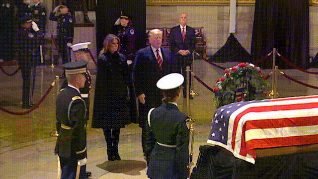 Military Ceremony Honors Bush The honor guard presents a final salute to the deceased veteran during the playing of taps. the washington post